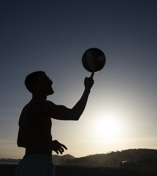 side-view-man-doing-tricks-with-ball